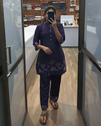 Model wearing deep purple embroidered kurta set with matching pants – elegant ethnic cord set for women