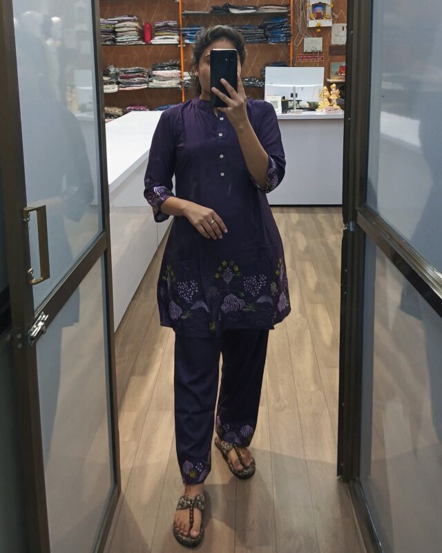 Model wearing deep purple embroidered kurta set with matching pants – elegant ethnic cord set for women