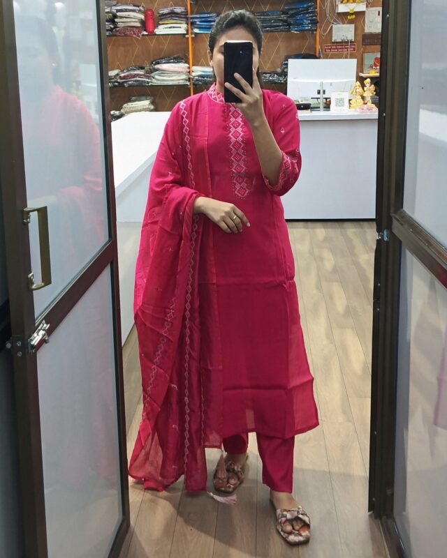 Model wearing bright pink embroidered salwar suit with designer dupatta – traditional Indian ethnic outfit for women